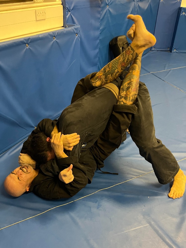 Students practising martial arts self-defence techniques at Shuhari Berkshire